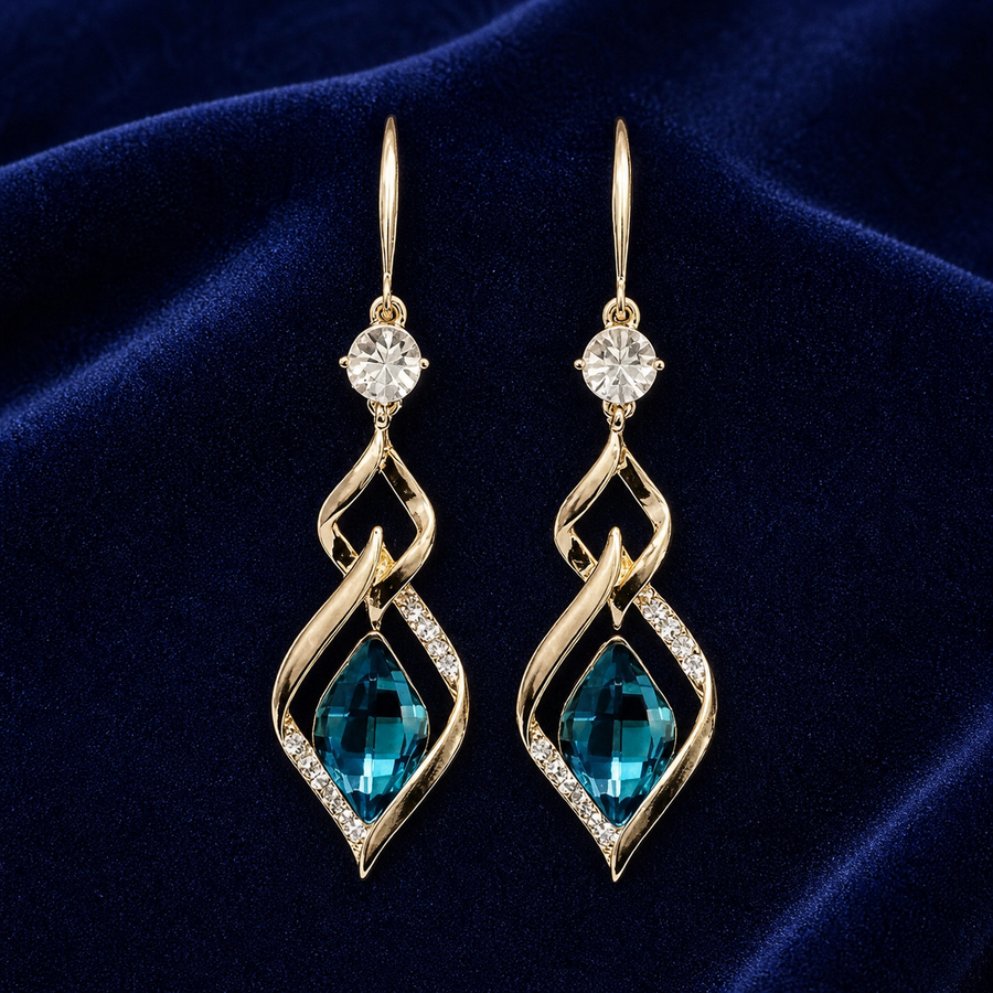 Blue glass twist drop earrings on navy velvet