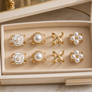 Eight-piece gold and pearl scarf ring set in velvet drawer