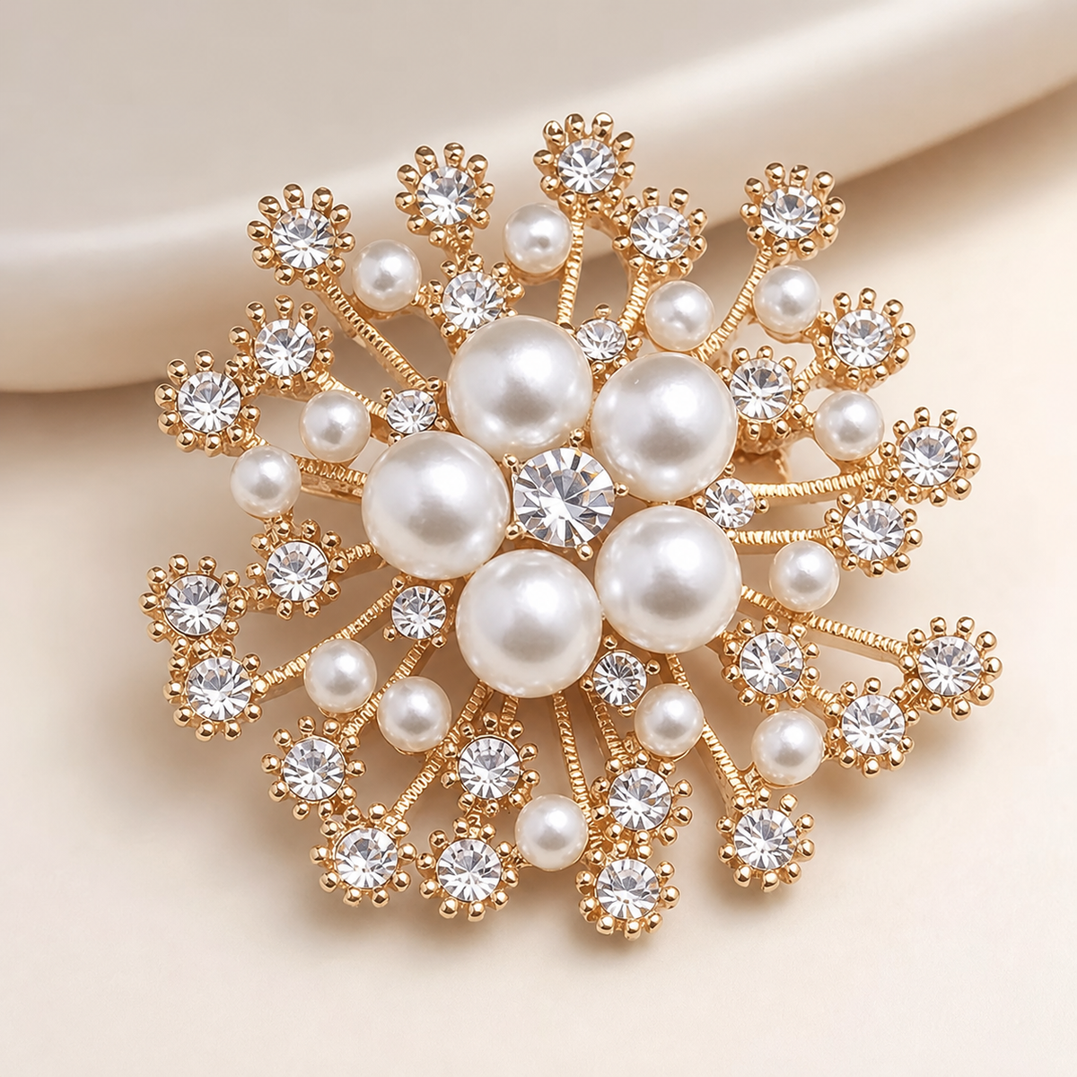 Gold-tone pearl and crystal snowflake brooch