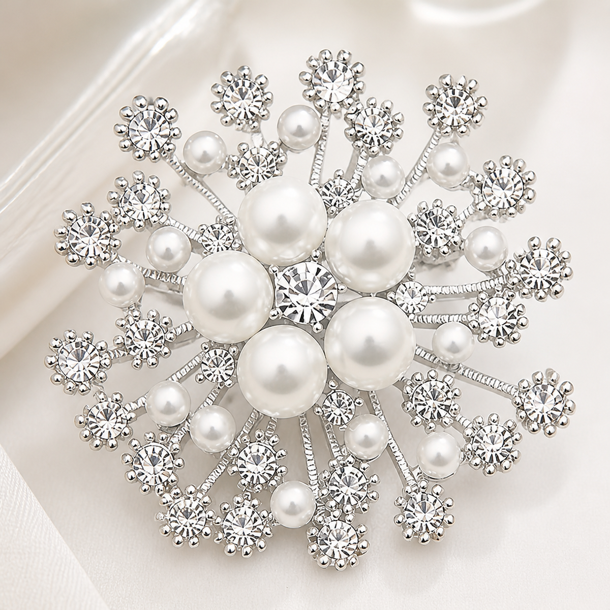 Silver-tone pearl and crystal snowflake brooch